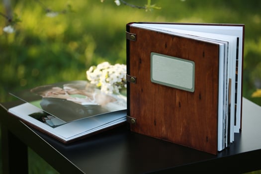 wooden photobook on the table. place for the inscription photo