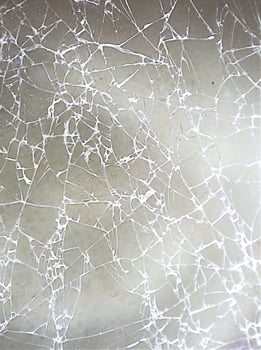 Cracked glass surface. Broken glass tablet computer. Cracked screen. Cracked glass of broken smart phone. photo