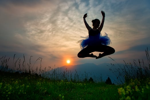 Girl dancer in nature at the sunset photo