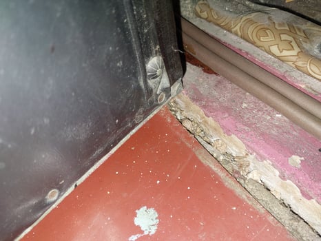 Installing a door seal against drafts and odors photo