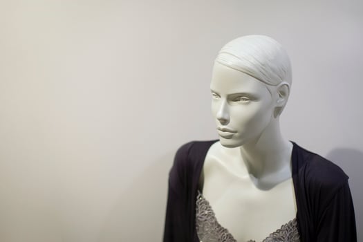 White mannequin on a gray background. photo