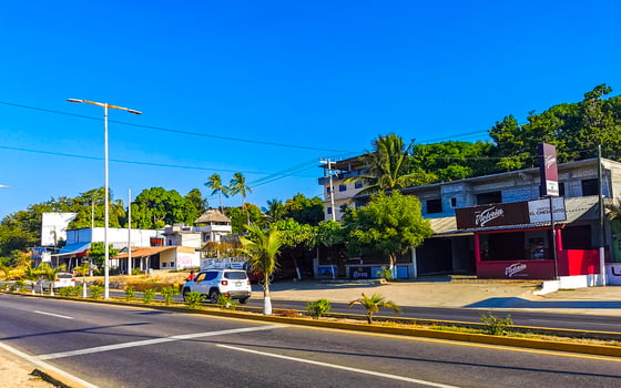Puerto Escondido Oaxaca Mexico 2022 Busy road street driving cars traffic jam Puerto Escondido Mexico. photo