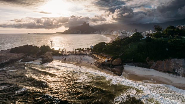 Aerial drone view above Praia do Diabo, Arpoador and Ipanema Beaches in Rio de Janeiro, Brazil on a cloudy day with many Cariocas enjoying the beaches photo