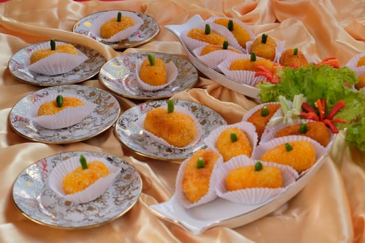 Kroket kentang is a traditional snack from Indonesia. served in wooden plate with green chilli. Delicious Indonesian Traditional Kroket Kentang with chilli photo