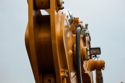 Close up detailed components of the yellow excavator photo