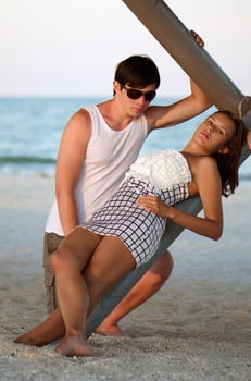 Beautiful young couple on the beach photo