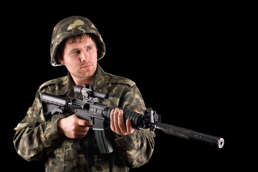 Arming soldier and a rifle photo