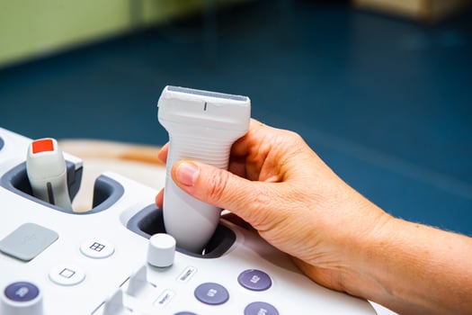 Medical specialists near ultrasound machine in the hospital ward photo