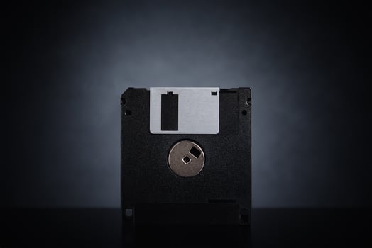 Floppy disk on dark background photo