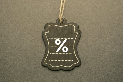 percent sign on the black price tag, black mockup background photo