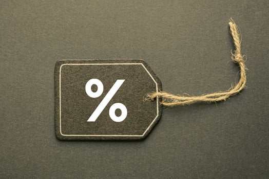 percent sign on the black price tag, black mockup background photo