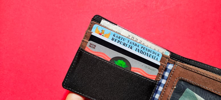 A wallet containing identity cards, driving licenses and motor vehicle certificates. photo