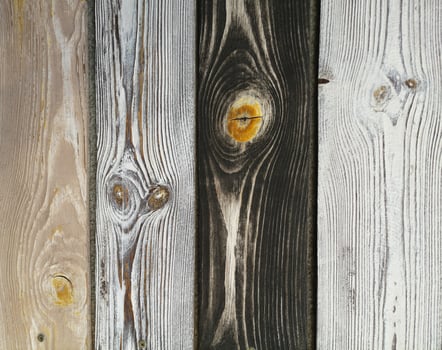 A close up of a wooden wall with different colored wood photo