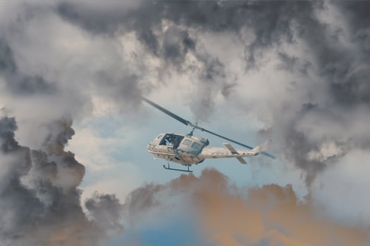 A Rescue Helicopter races against an oncoming Storm severe weather,Modern attack helicopter with with weapons photo