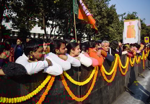 New Delhi, India - January 16 2023 - Thousands of people collected during Prime Minister Narendra Modi BJP road show, people during PM Modi big election rally in the capital photo