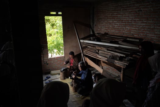 Keris craftsmen are teaching visitors about the process of making keris in the workshop. Bantul, Indonesia - 25 August 2022 photo