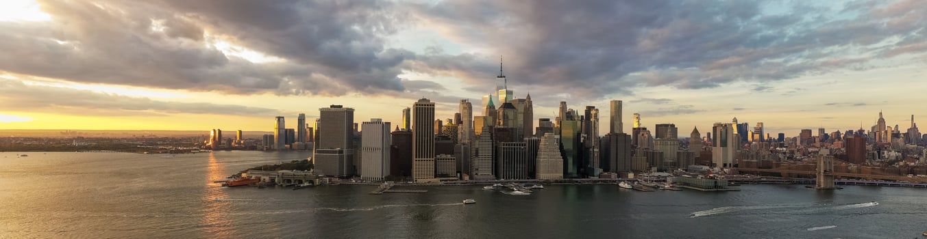 Aerial view of Manhattan in New York City from Brooklyn at sunset. photo
