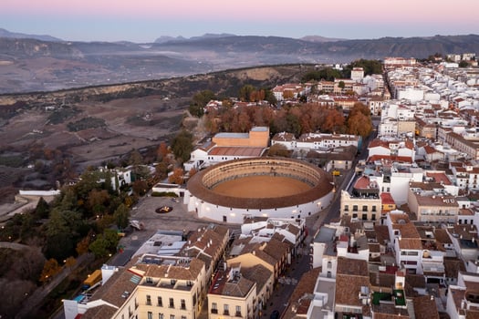 Bullring of the Royal Cavalry of Ronda aerial view at sunrise in Spain. photo