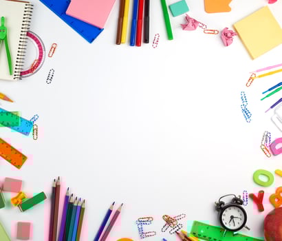 school supplies multicolored wooden pencils, paper stickers, paper clips photo
