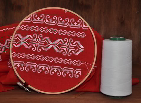 Red fabric with embroidery pattern photo