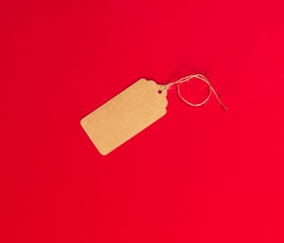 empty brown paper tag for clothes on a rope photo