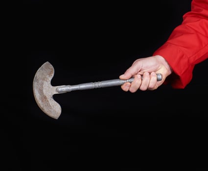 chef in red textile uniform holding old metal knife photo