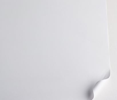 blank white sheet of paper with a curved corner photo