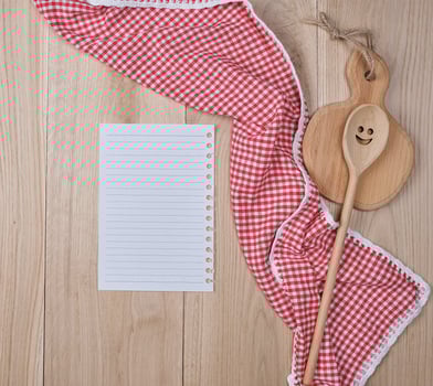 empty line paper in a line and kitchen wooden utensils photo