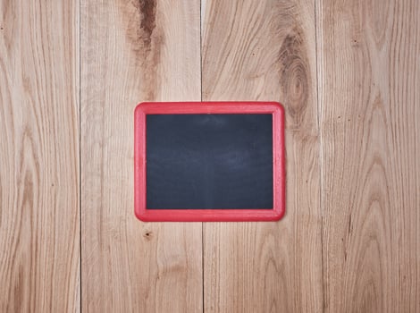 red frame on a background of oak boards photo
