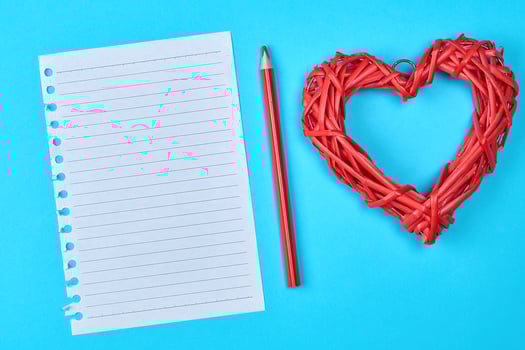 blank white piece of paper in a line and a red wooden pencil photo