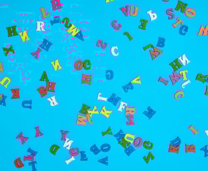 multicolored English alphabet letters on a blue background photo