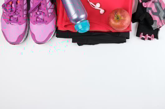 women's sportswear for fitness,  bottle, headphones and sneakers photo