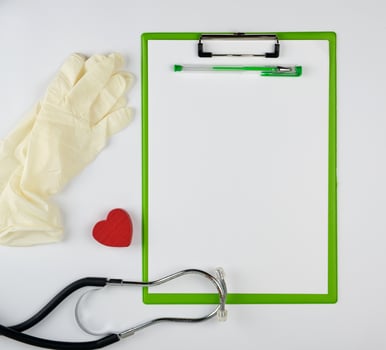 medical stethoscope and green paper holder photo