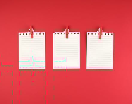 white blank sheet in a line torn out of notepad photo