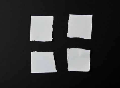 torn into four pieces empty white sheet of paper photo