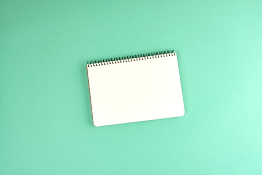 open spiral notebook with clean white sheets photo