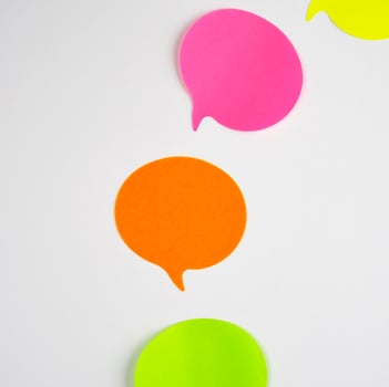 multicolored paper stickers on a white background photo
