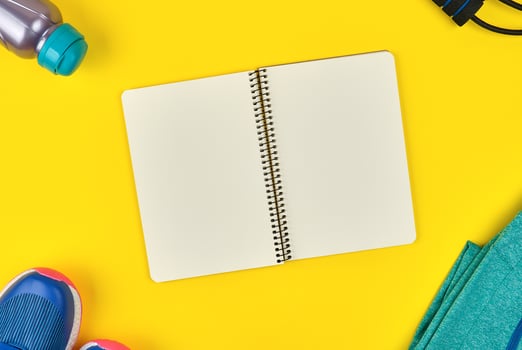 open empty notebook and sports women's clothing for sports photo