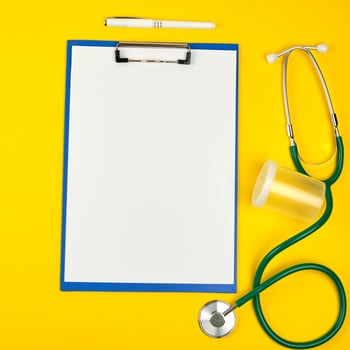 empty white sheets and medical stethoscope photo