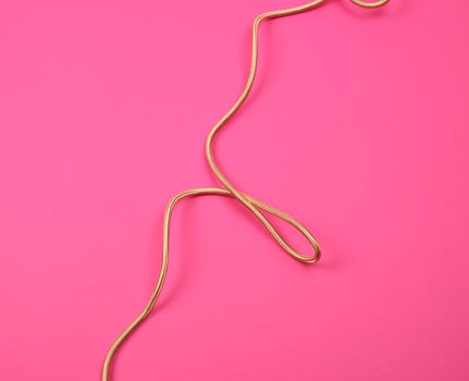 twisted golden cable for equipment in textile winding photo