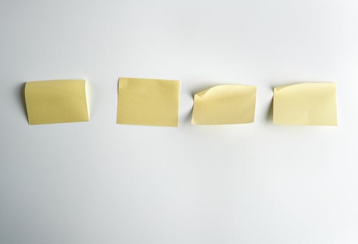 yellow paper stickers on white background photo