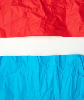crumpled red and blue on paper on a white background photo