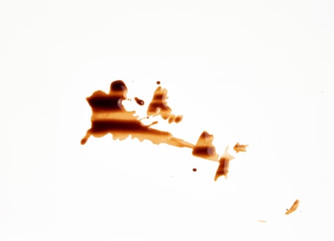 spilled black coffee on white paper, abstract stains photo