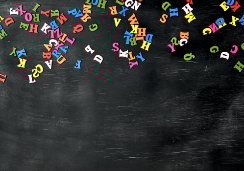 multicolored small wooden letters of the English alphabet photo