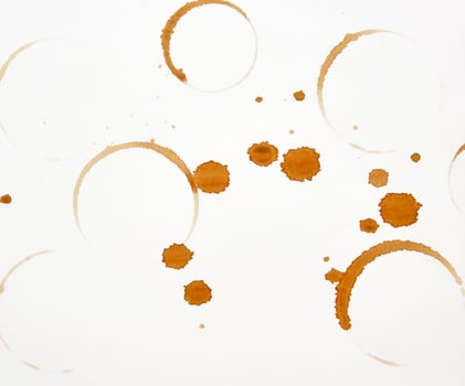 lot of round imprint from a coffee cup on a white paper background photo