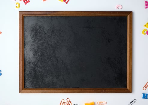 empty black chalk frame, white  background, photo