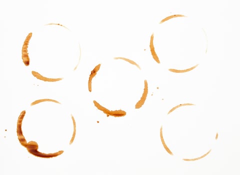 lot of round imprint from a coffee cup on a white paper background photo