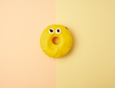 round yellow banana donut on a colored background photo