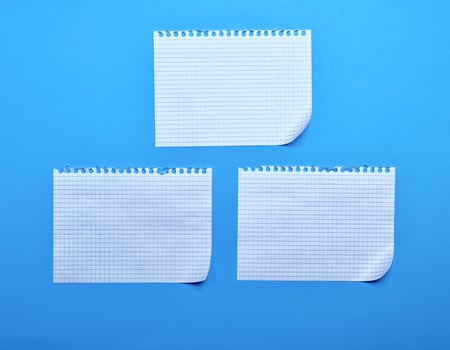 three blank sheet of paper with curved corners photo