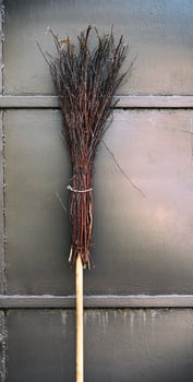 old broom on a wooden handle photo